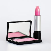 Stylish pink lipstick and blush makeup set on a white background, perfect for beauty and cosmetics branding.